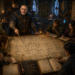 Frank Jamison, portrayed as a seasoned guildmaster and veteran adventurer, stands at the center of a bustling fantasy guild hall, guiding a diverse group of adventurers around a massive strategy table. The table is covered with detailed architectural diagrams, software-inspired maps, flowcharts, and handwritten guild principles rendered as medieval cartography. Shelves of scrolls, books, and guild records line the walls, while lanterns and warm candlelight illuminate the collaborative scene. Adventurers of multiple races and classes study notes, discuss plans, and learn from Frank's guidance. The image symbolizes code readability, mentorship, onboarding, documentation, and teamwork through visual metaphors of maps, pathways, and shared knowledge within a thriving adventurer's guild.
